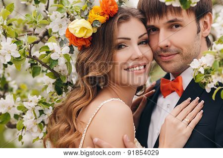 The bride and groom - photo in a flowery Park in the spring.