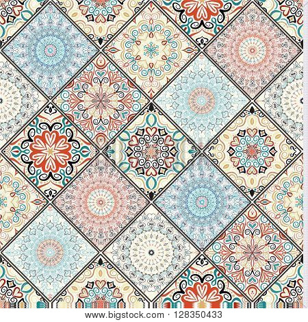 Rich tile ornament from colorful mandalas. Seamless pattern in oriental style. Square tile patchwork design. Intricate tile pattern. Boho chic tile pattern for fashion fabric, furniture, wallpaper.