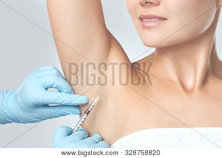 The Doctor Makes Intramuscular Injections Of Botulinum Toxin In The Underarm Area Against Hyperhidro