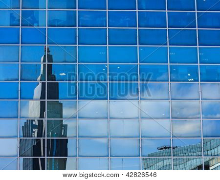 The reflection in the windows of the building