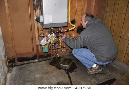 Man Fixing Furnace