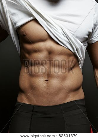 Closeup Photo Of An Athletic Guy With Perfect Abs