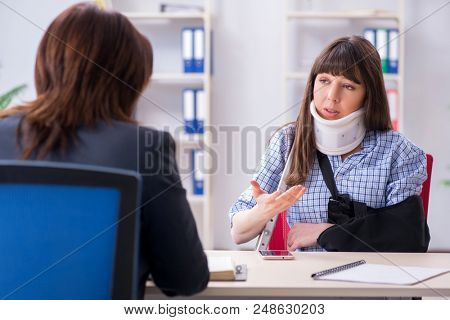 Injured employee visiting lawyer for advice on insurance