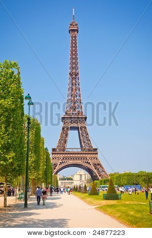 PARIS - APRIL 25: Tourists enjoy sunny day near  Eiffel Tower on April 25, 2011 in Paris, France. Eiffel Tower  stands 324 meters tall and is the tallest building in Paris.