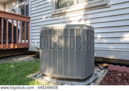 Residential Air Conditioning Unit With A New Condenser Unit Has Just Been Installed