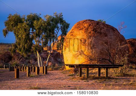 Devil's Marbles is a famous formation of round rocks in the Australian Outback and visited by many tourists on their way to the red centre. In the morning the rocks turn into beautiful orange colour.