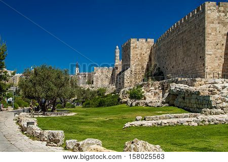 JERUSALEM ISRAEL - APRIL 5: Part of the historic wall of the Old City and the Tower of David near the Jaffa Gate to western edge of the Old City of Jerusalem Israel on April 5 2015