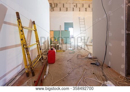 Working Process Of Installing Plasterboard Or Drywall For Making Gypsum Walls In Apartment Is Under 