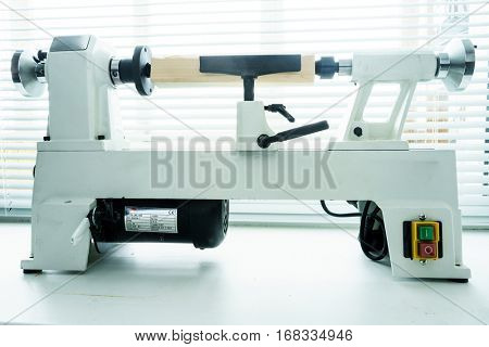 Woodworking Machine, Mini Woodworking Lathe Close Up Detail, Wood Shavings Tools, Woodworking Machinery, Small Woodwork Lathe in a Joinery Workshop, Woodwork on the Machine, Spindle Turning