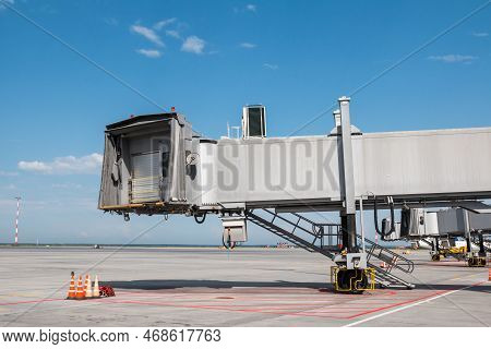 Empty Passenger Jet Bridges At Airport Apron