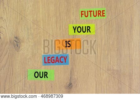 Legacy And Future Symbol. Concept Words Our Legacy Is Your Future On Colored Paper. Beautiful Wooden