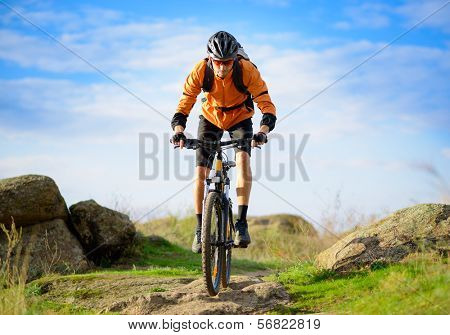 Cyclist Riding the Bike on the Beautiful Spring Mountain Trail