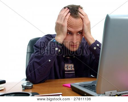 Stressed out businessman at his computer