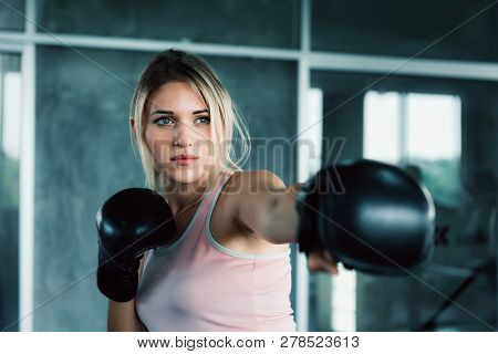 Female Boxer Is Training Punching In Fitness Gym.,portrait Of Boxing Woman Is Practicing Footwork In