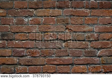 Brick Red Wall. Background Of A Old Brick House.