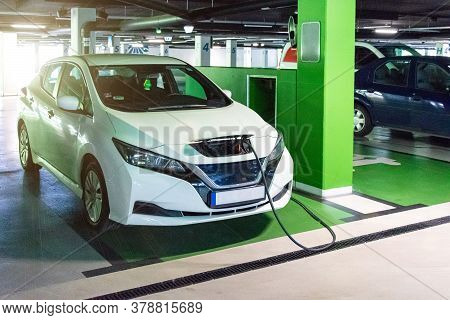 Green Concept Car. Hybrid Vehicle - Green Technology Of Future. Electric Car Charge Battery On Eco E