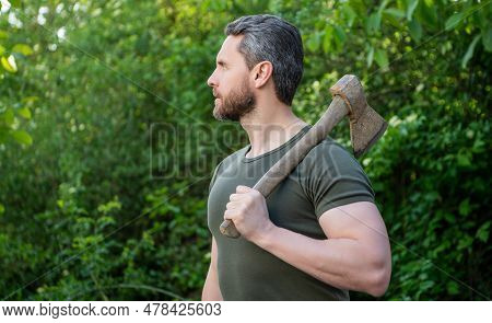 Man Hold Axe Wearing Shirt. Man With Axe Outdoor. Photo Of Man With Axe. Man With Axe