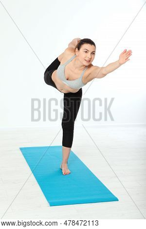 Sport. Fitness Yoga Woman. Beautiful Middle-aged Woman Doing Yoga Poses. Concept People Are Workout 