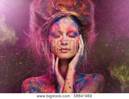 Young woman muse with creative body art and hairdo 