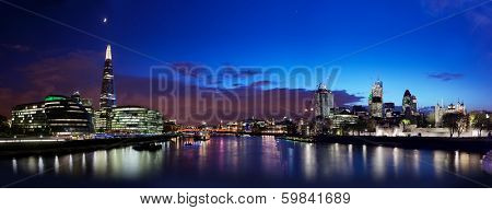 London skyline panorama at night, England the UK. Tower of London, The Shard, City Hall, River Thames as seen from Tower Bridge