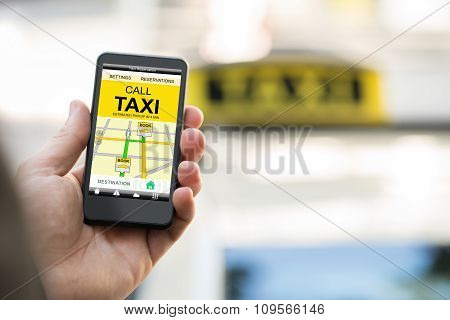 Person Booking Taxi On Smart Phone