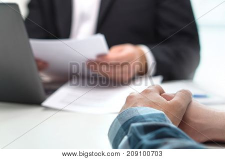 People having meeting in office. Boss with a job applicant in interview. Lawyer with client. Business man or bank worker having discussion about loan or insurance. Financial advice. Giving feedback.