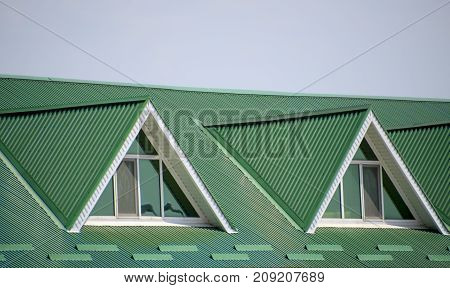 The House With Plastic Windows And A Green Roof Of Corrugated Sh