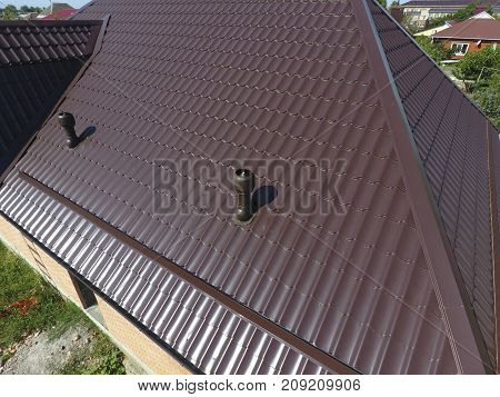 Air Ducts On Metal Roof. The Roof Of Corrugated Sheet. Roofing O