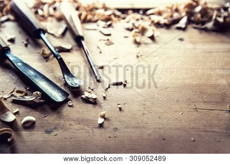 Woodworking Vintage Tools Chisels With Wood Shawings On Retro Workbench.