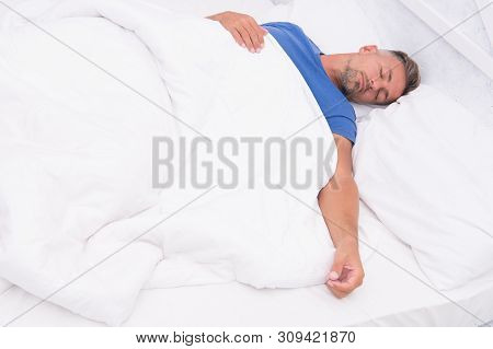 Healthy Habits. Man Handsome Guy Lay In Bed Sleeping. Get Enough Amount Of Sleep. Tips Sleeping Bett