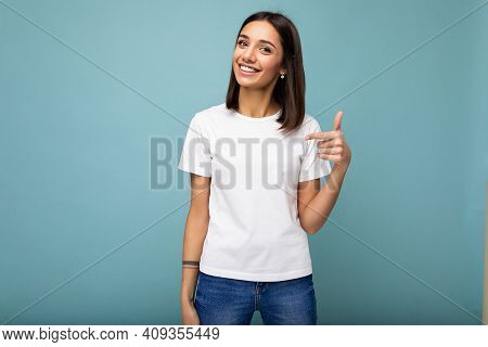 Portrait Of Young Beautiful Happy Smiling Brunette Woman Wearing Trendy White T-shirt With Empty Spa