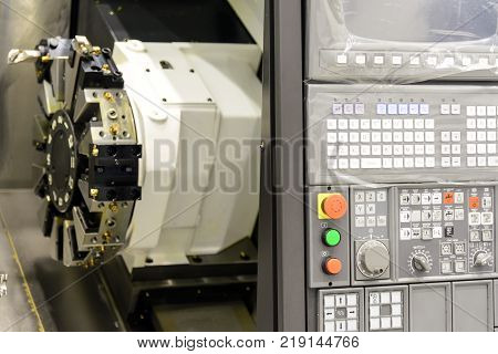 Close up of the CNC lathe panel .CNC lathe or CNC turning machine. Hi-precision CNC machining concept.