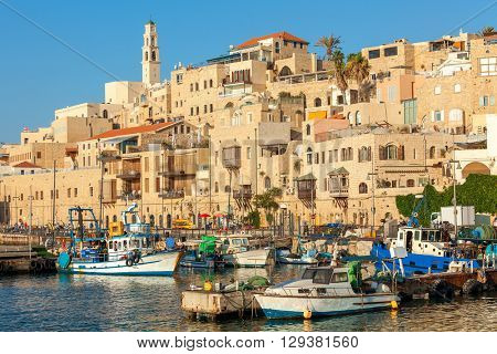 Boats on small harbor and old houses in Jaffa, Israel.