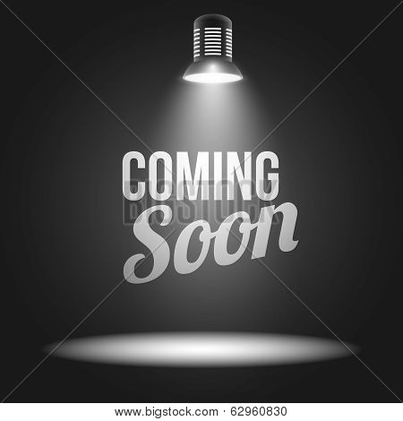 Coming soon message illuminated with light projector