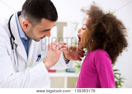 Pediatrician Examining Cute Smiling African Girl, Throat Sick