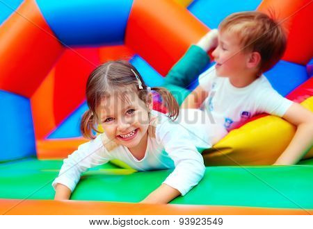 Happy Kids Having Fun On Playground In Kindergarten