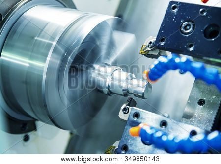 The Cnc Lathe Machine In Metal Working Process Cutting Thread The Metal Shaft Parts With In The Ligh