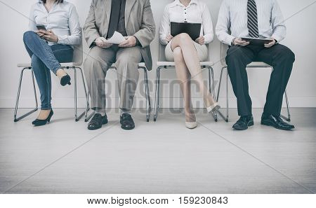 recruitment recruiting hire recruit hiring recruiter interview employment job human room stress stressful position young group formal work chair corporation corporate sitting concept - stock image