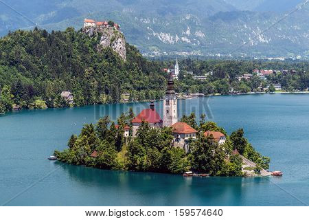 Aerial view of Lake Bled, a lake in the Julian Alps of the upper Carniola region, Slovenia, with the pilgrimage church of the Assumption of Maria, on the Bled island, taken from Osojnica hill