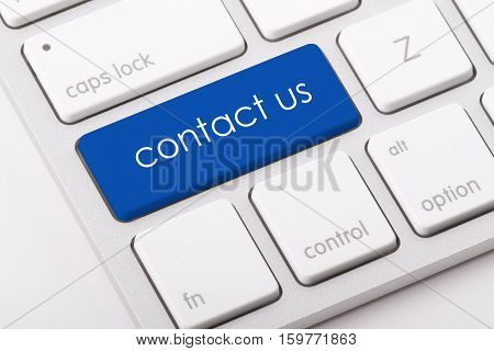 Contact us word written on computer keyboard.