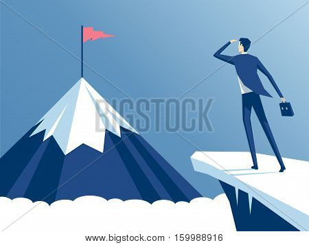 businessman standing on cliff's edge and looking at the mountain on which he will climb an employee looking for a way to his goal business concept challenge and the goal