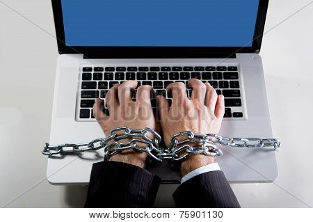 Hands Of Businessman Addicted To Work Bond With Chain To Computer Laptop In Workaholic