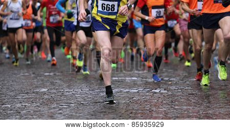 Runners During Marathon While It Is Raining