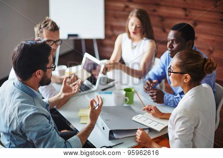 Group of multi-ethnic business partners discussing ideas