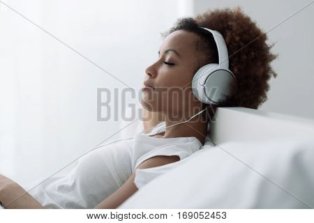 Woman Relaxing And Listening To Music