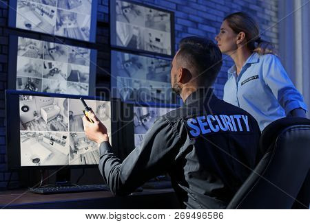 Security Guards Monitoring Modern Cctv Cameras Indoors