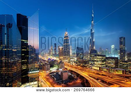 Beautiful Aerial View To Dubai Downtown City Center Lights Skyline At Night, United Arab Emirates. L