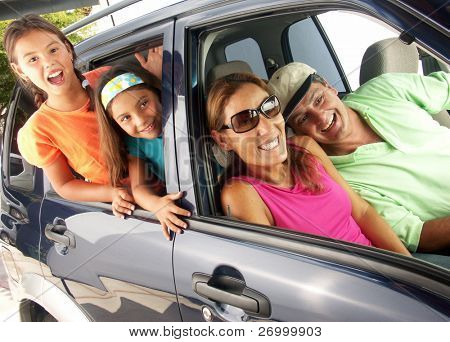 Hispanic family in a car.
Family tour in a car.