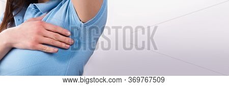 Armpit Sweat And Hyperhidrosis. Sweating Woman Arm