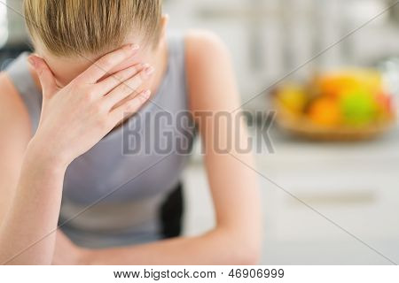 Portrait Of Stressed Young Housewife In Modern Kitchen